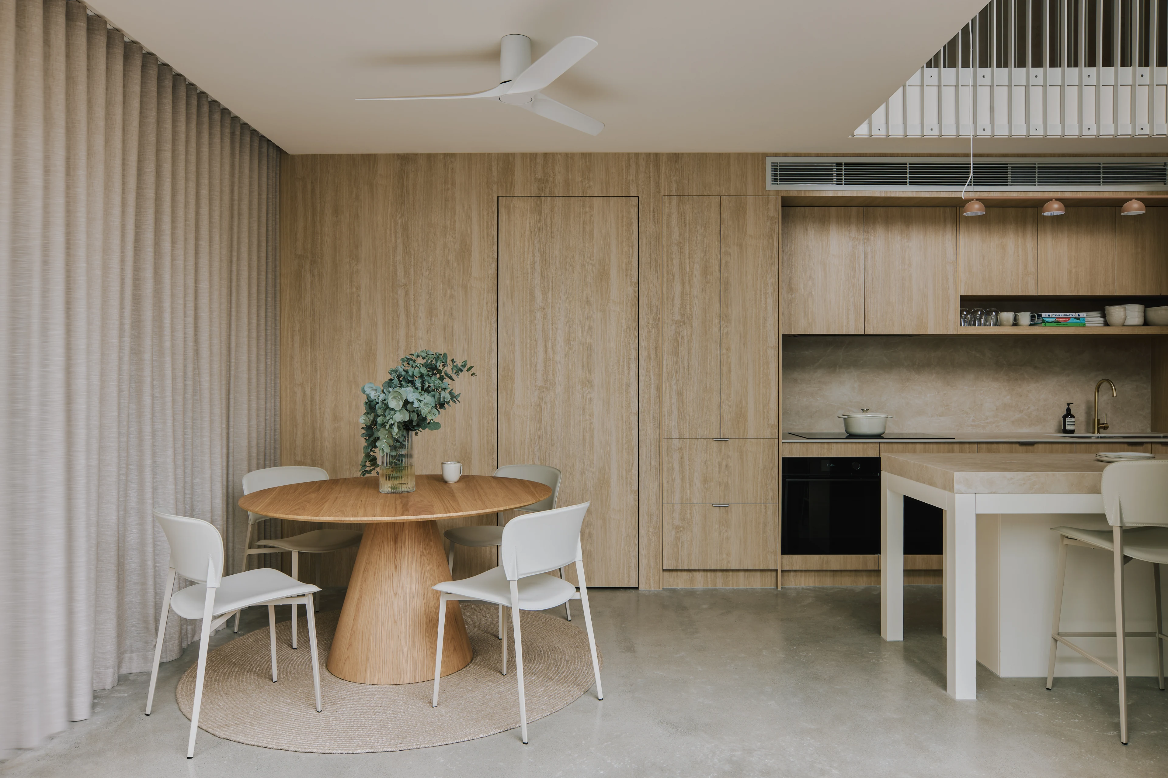 Palmera dining and kitchen spaces with full-height timber joinery
