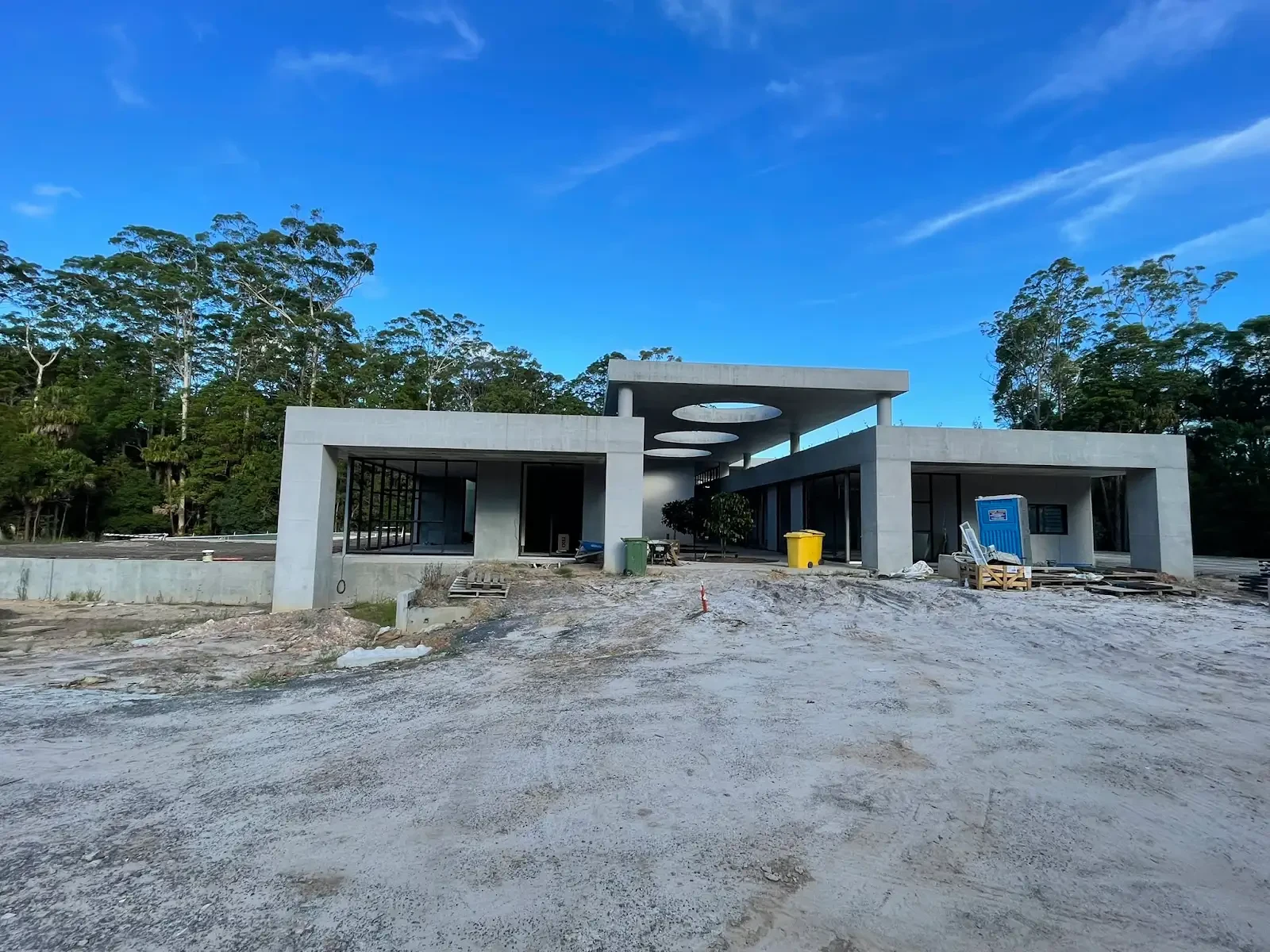 The Villa — concrete facade and circular roof openings during construction