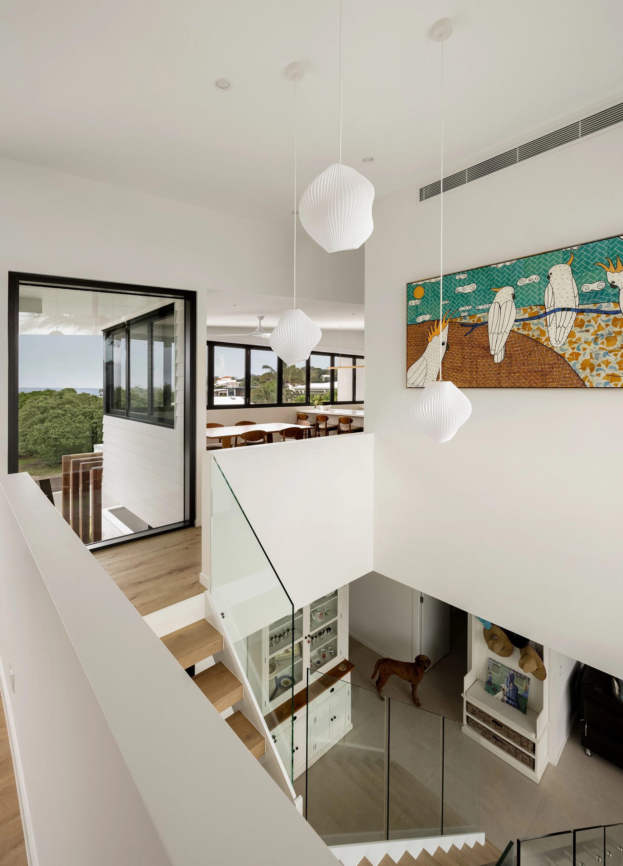 Upper landing and double-height living space at 47 Wavecrest