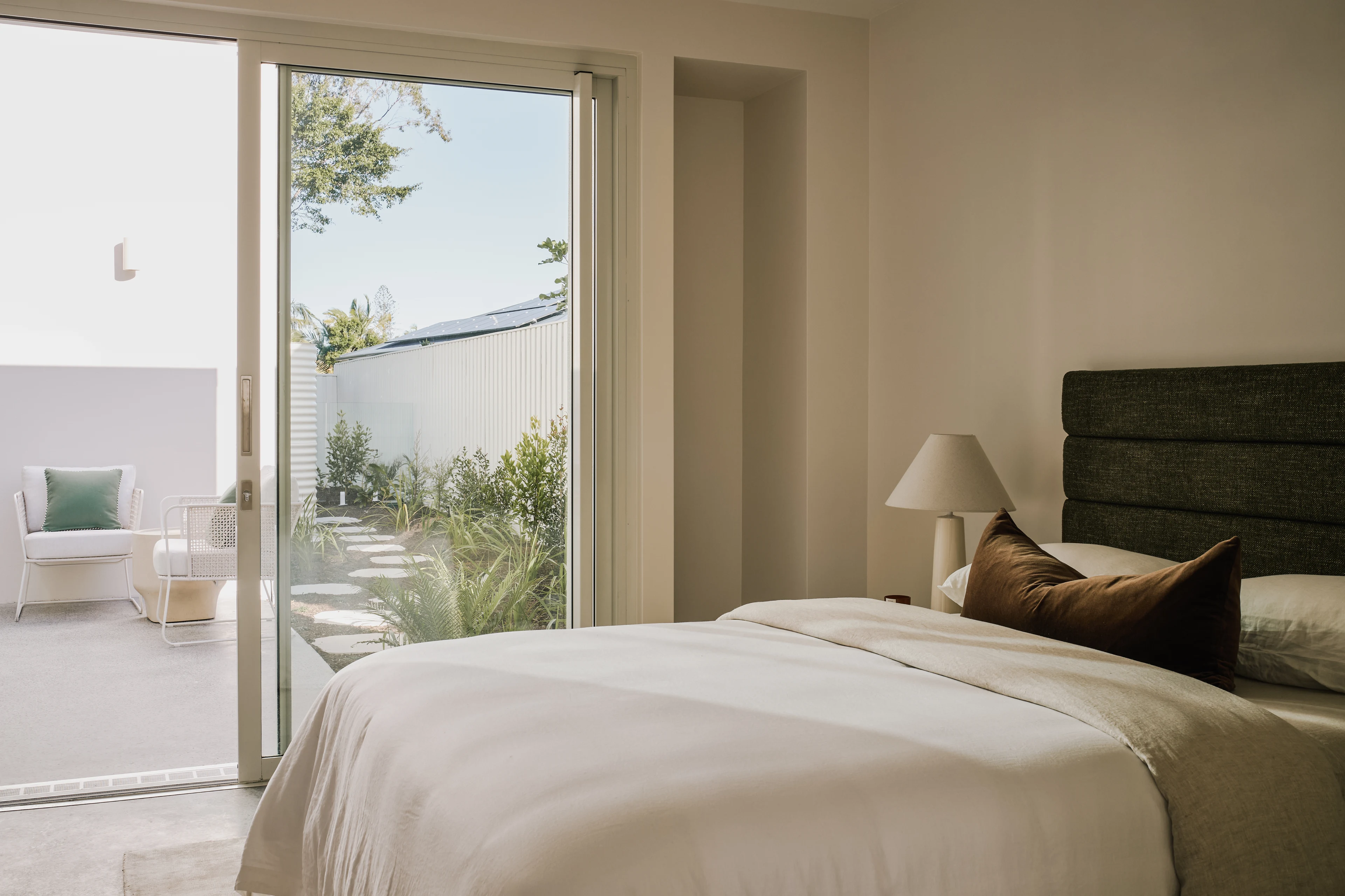 Bedroom opening onto a planted terrace