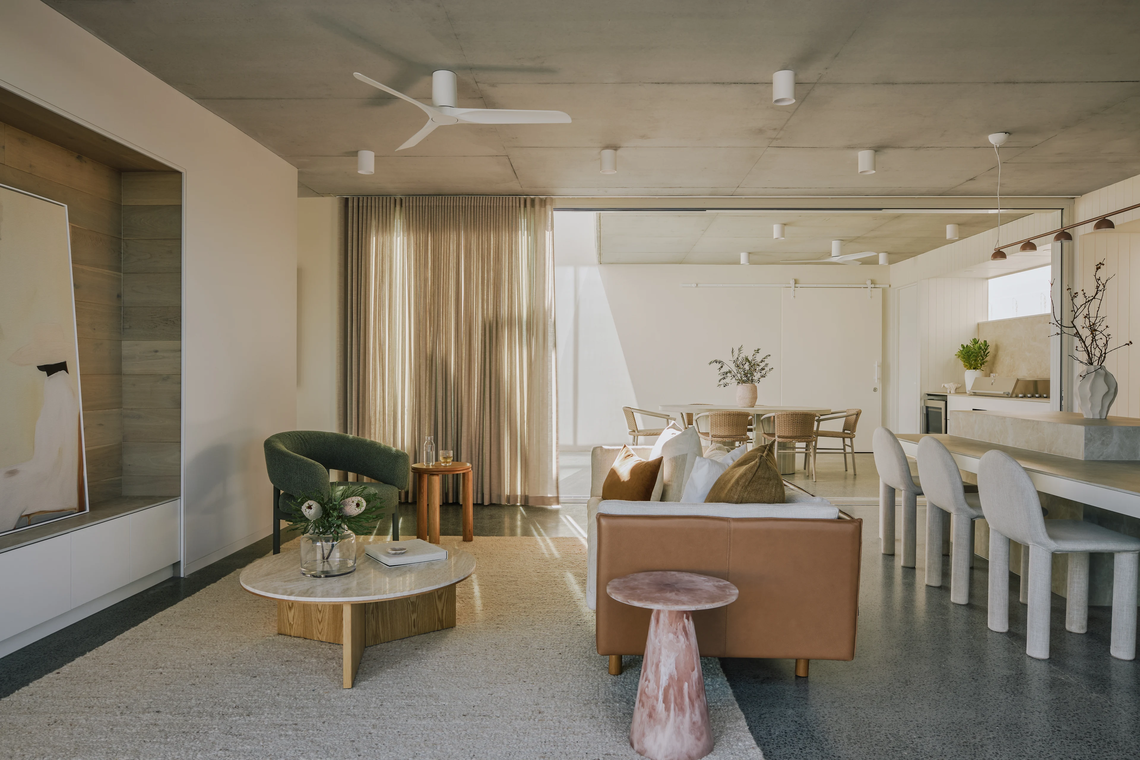 Living and dining spaces opening to the garden